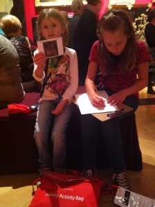 Completing the puzzles in the family kit, in the Queen's Gallery